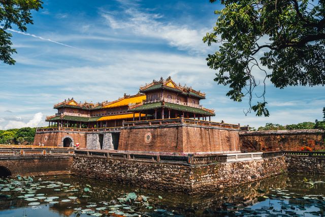 Ngọ Môn gate of the Huế Imperial City above a lotus moat